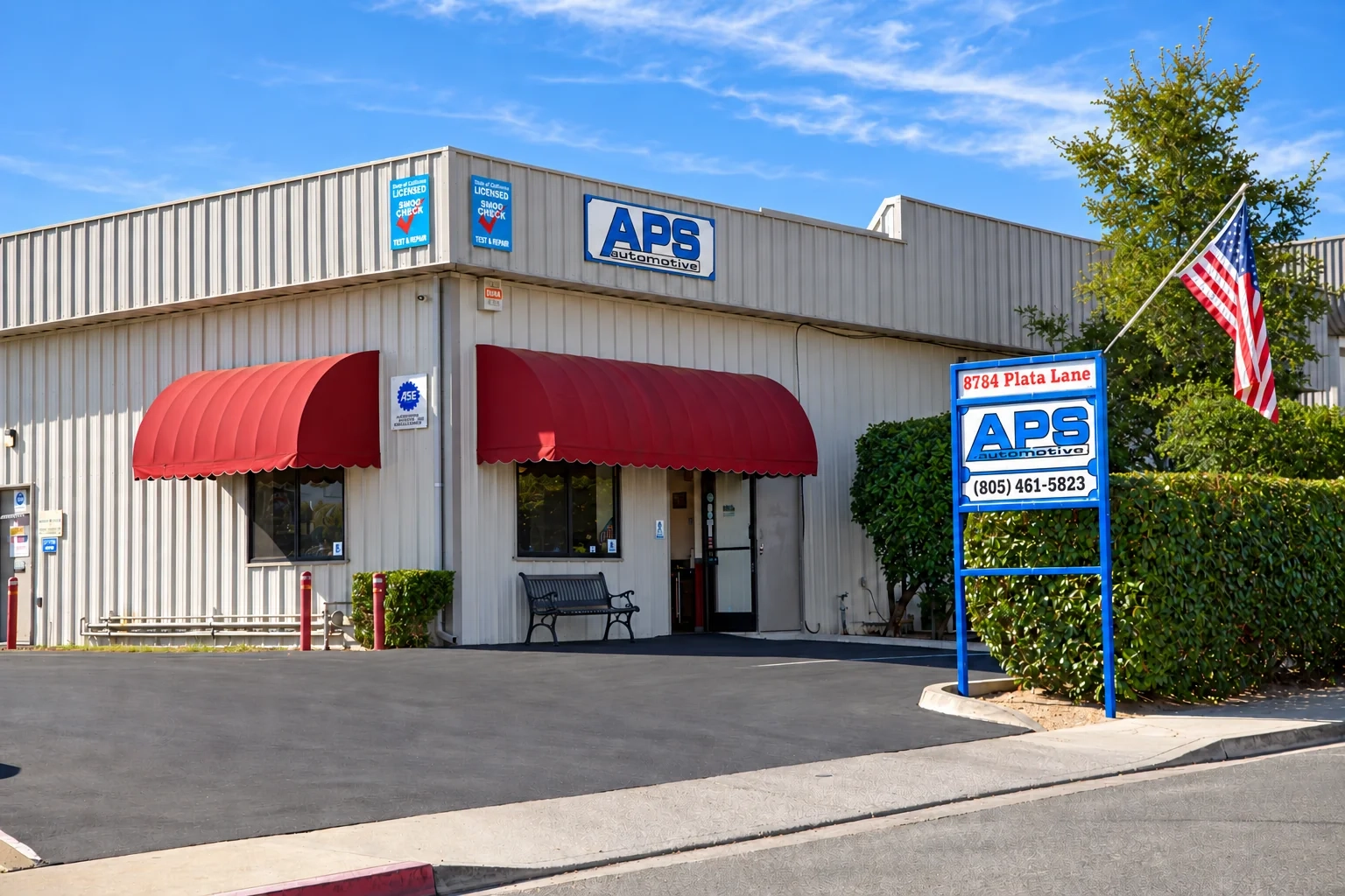 APS Automotive shop exterior with service bays open
